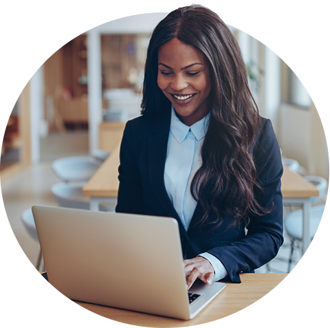 Woman working on laptop at desk