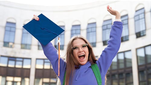 girl holding graduation cap