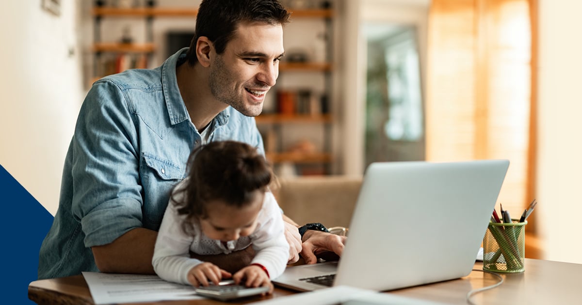 Father and child looking at laptop computer