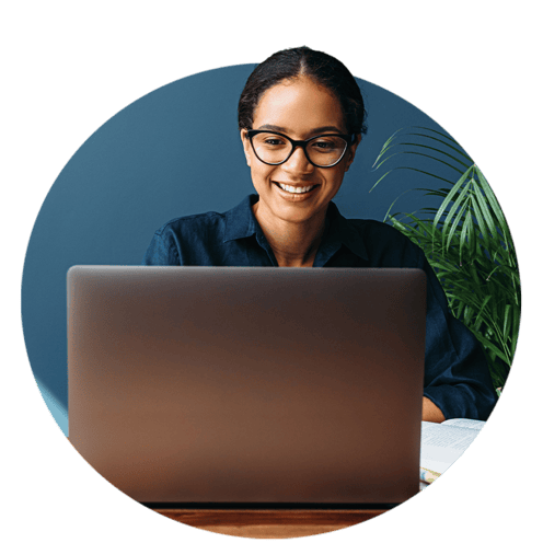 Woman with glasses and black hair on computer