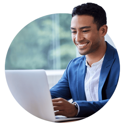 Man with blue suit working on a computer